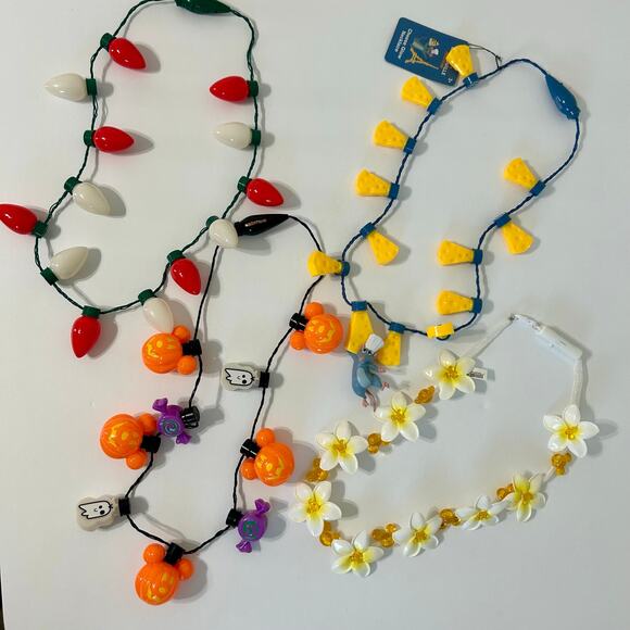 Disney Parks Lot of 4 Light Up Necklaces NWT Aulani Remy Halloween Christmas - Picture 1 of 11